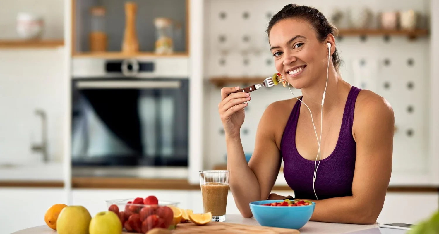 Woman over 40 eating healthy meal after workout