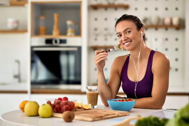 Woman over 40 eating healthy meal after workout