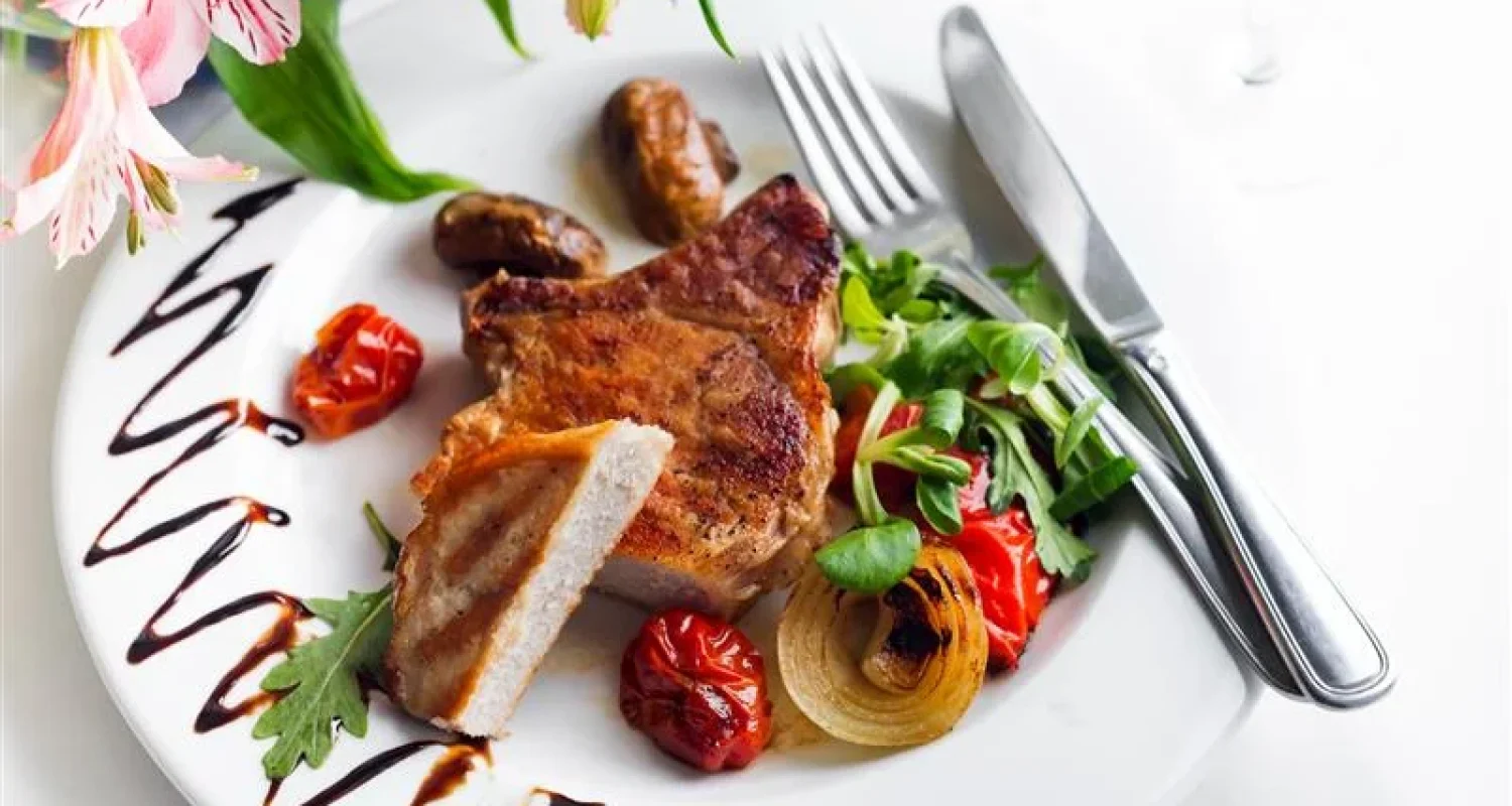 Plate with grilled chicken, roasted vegetables and avocado — savory high-protein breakfast